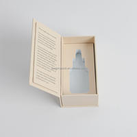 Boîte en carton rectangulaire beige à ouverture rabattable avec étui, doublure en mousse EVA personnalisée, emballage de luxe pour sérum pour la peau, huile parfumée de 30 ml