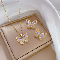 KISSWIFE Ensemble en Cuivre Plaqué Or avec Zircons, Collier et Boucles d'Oreilles Fleur Papillon en Acier Inoxydable pour Femme