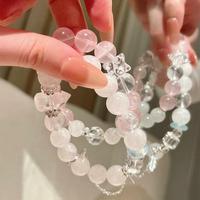 Bracelet de luxe de haute qualité pour femme, élégant, fait main, avec perles roses transparentes et accent étoile, idéal pour les soirées