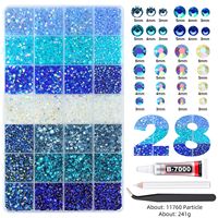 Vente Flash Transfrontalière : Boîte de 24/28 compartiments de breloques pour ongles, perles et strass en résine à dos plat, kit de décoration DIY pour nail art