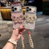 Coque de téléphone à chaîne papillon dégradé avec nœud et coquillage pour iPhone 17 16 15 Pro Max, avec breloques diamantées et lanière scintillante