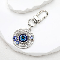 Porte-clés ethnique turc en métal émaillé, forme cœur rond, avec œil bleu porte-bonheur contre le mauvais œil