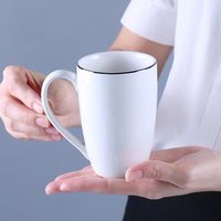 Fournisseur de tasses à sublimation personnalisées pour eau et lait, tasse à café en céramique blanche à sublimation avec bord noir