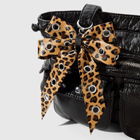Porte-clés et pendentif de sac rétro, style doux et cool, avec motif léopard, motif laitier, motif œil, couleur unie et nœud