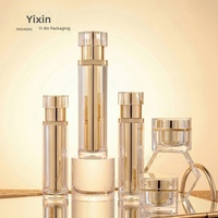 Stock Disponible : Ensemble de Produits Cosmétiques et de Soins de la Peau en Acrylique, avec Pot d'Essence et Crème Hydratante Doré Électroplaqué, Emballage en Boîte pour Reconditionnement