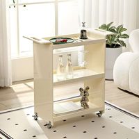 Chariot de présentation moderne et minimaliste en acrylique transparent, écologique, amovible, à 4 roues, pour l'expérience d'échantillonnage en magasin de cosmétiques