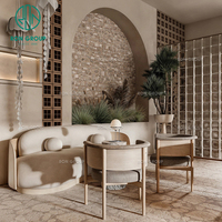 Ensemble de mobilier haut de gamme moderne en marbre rond, bois et cuir pour hôtels, cafés et restaurants : table, chaise et banquette.