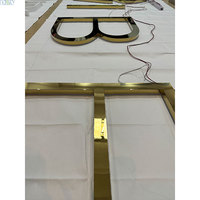 Enseigne lumineuse rétroéclairée en acier inoxydable or argent avec lettres et miroirs pour décoration d'entreprise