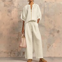 Ensemble pantalon deux pièces tendance été 2026 pour femme, grande taille, streetwear, haut uni à fermeture éclair à manches courtes et pantalon palazzo, vente en gros