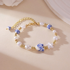 Bracciale in ceramica con perle e fiori, stile porcellana blu e bianca, collezione Primavera Estate 2026, per donna - Product Image 4