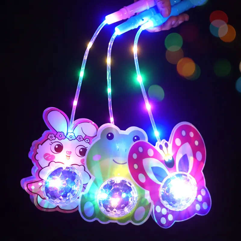 Desain baru menyala mainan genggam desain kartun LED warna-warni bercahaya bola gelombang portabel lentera portabel