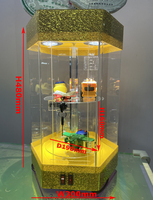 Vente en gros d'usine Vitrine rotative hexagonale en acrylique avec étagères rondes à niveaux, système d'éclairage LED supérieur et porte verrouillable
