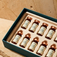 Boîte rigide personnalisée avec couvercle et base verts pour 12 flacons de peptides, en pulpe moulée avec logo estampé à chaud