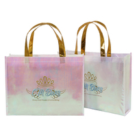Nouveau design de sac fourre-tout à provisions non tissé rose laser brillant avec poignée dorée Logo imprimé