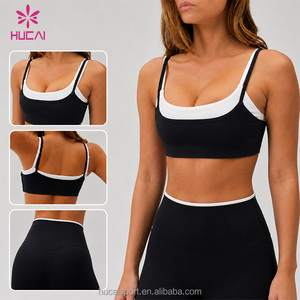 Ensemble de sport 2 pièces ODM HUCAI avec logo personnalisé, design bicolore, bretelles réglables, soutien-gorge de sport double couche et leggings de <span class=keywords><strong>yoga</strong></span> - Product Image 1