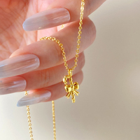 Collier pendentif nœud papillon 3D plaqué or 18 carats hypoallergénique pour femme, chaîne délicate en forme de ruban, vente en gros