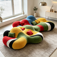 Canapé incurvé en patchwork multicolore, forme organique irrégulière, tissu design, canapé de détente pour villa, hôtel, mobilier de hall