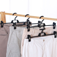 Porte-pantalons multifonctionnel et durable à plusieurs niveaux avec pinces en métal et plastique pour le rangement de sous-vêtements, jupes et pantalons