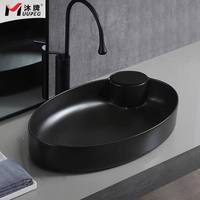 Lavabo ovale moderne avec égouttoir, facile à nettoyer, aspect pierre, entièrement en céramique cristallisée, à poser sur comptoir, noir mat, avec levier