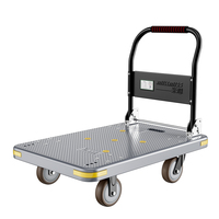 Chariot à plateforme en plastique robuste à quatre roues pliable pour le transport de marchandises industrielles