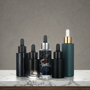 Botella de Vidrio con Gotero de 30 ml, Personalizada en Negro, Naranja y Azul, Multicolor, con Fondo Grueso y Tapa Serigrafiada para Uso Cosmético - Product Image 3