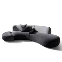 Canapé modulable minimaliste italien, conçu pour les salons de toutes tailles, avec un tissu en forme d'arc et à motif ciel étoilé dégradé