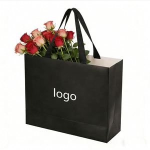 Factory Direct Customizable Matte Black <b>Paper</b> Shopping Bag With Ribbon Handles Luxury Ideal for Boutique & Clothing Packaging - Product Image 1