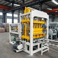 Ligne complète de machine de fabrication de blocs de ciment hydraulique entièrement automatique contrôlée par PLC QT4-15 pour briques creuses et emboîtables de haute qualité