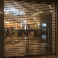 Porte à enroulement en polycarbonate anti-humidité avec design transparent pour centres commerciaux et cafés