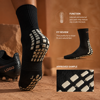 Chaussettes de football renforcées noires mi-mollet avec coussinets internes et externes pour une adhérence optimale sur le terrain, profil mince, adaptées aux crampons, avec tableau de tailles
