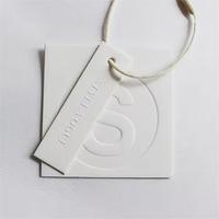 Étiquettes volantes étiquettes de vêtements en feuille d'aluminium Logo personnalisé étiquettes volantes blanches feuille d'or estampage à chaud étiquettes volantes pour jeans et vêtements
