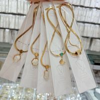 Позолоченное 18-каратным золотом ожерелье из нержавеющей стали с цепочкой в виде змеиной кости, подвесками в виде ракушек, изумрудов и бабочек, подарок для женщины
