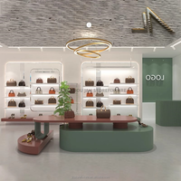 Vitrine de présentation de sacs à main tendance avec éclairage, armoire murale pour sacs, couches personnalisées pour l'affichage en magasin