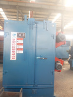 Machine de sablage pour le nettoyage de grandes pièces moulées de wagons de chemin de fer