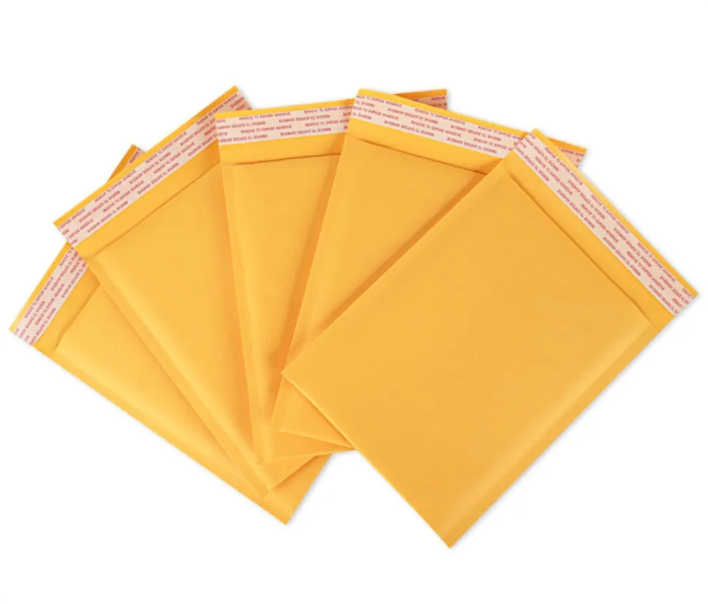 Bolsa de burbujas de papel Kraft grueso Fabricantes al por mayor Bolsa de embalaje amarilla a prueba de golpes Bolsa exprés Bolsa de sobre de espuma de papel Kraft