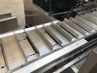 Machine d'emballage et de cartonnage pour semelles de chaussures