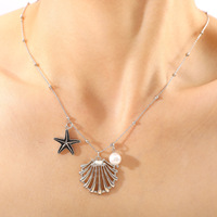 Collar de acero inoxidable Ocean Series con cadena de eslabones de moda de perla de concha de estrella de mar de cristal de playa para compromiso
