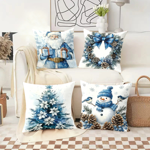 Bantal Natal dengan desain Santa, manusia salju, karangan bunga, dan pohon dalam warna biru dan putih yang nyaman. - Product Image 2