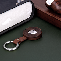 Nouvelle conception de coque de protection antichoc anti-perte pour le localisateur Air Tag en gros avec porte-clés élégant