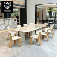 Table à manger rectangulaire moderne avec bords arrondis pour intérieurs haut de gamme, table à manger de luxe en marbre et acier inoxydable