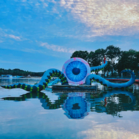 Pompe à air multicolore étanche avec lumières LED intégrées pour gonflables publicitaires de type « Big Eyed Monster » pour expositions et usages commerciaux
