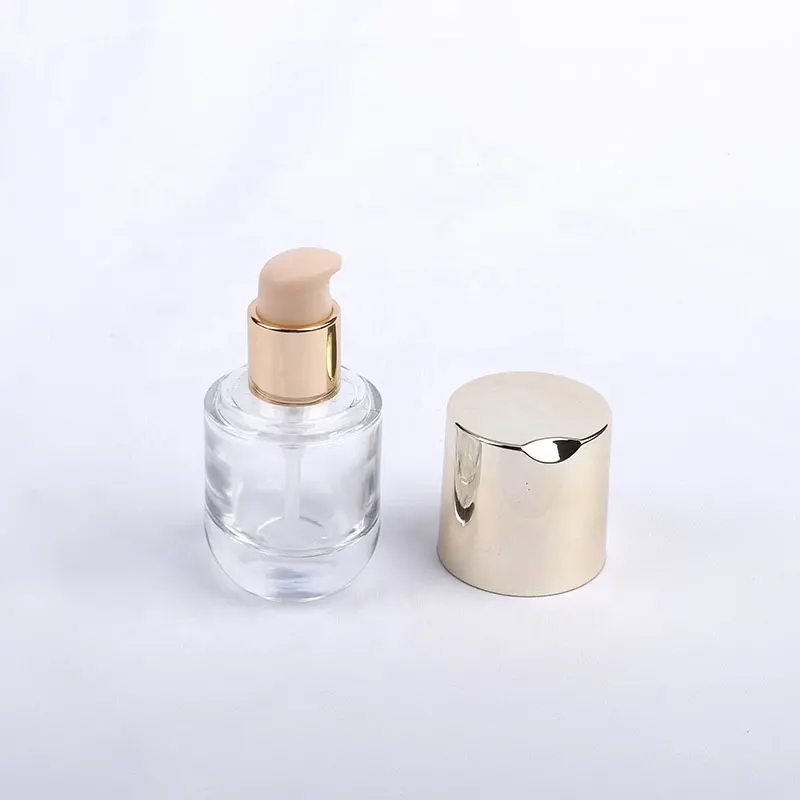 Flacone per pompa Spray per siero per fondotinta liquido cosmetico rotondo trasparente di lusso da 30ml con labbro della pompa in oro rosa