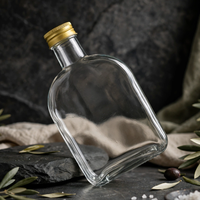 Bouteille en verre rectangulaire plate personnalisable, idéale pour les jus, les boissons et les boissons froides, avec des couvercles dorés