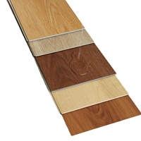 Revêtement de sol SPC emboîtable DIY : Luxe abordable, écologique, ignifuge, imperméable, panneaux polymères personnalisés à grain de bois pour