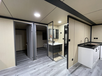 Maison conteneur extensible à 2 étages avec escalier, aménagement intérieur personnalisé, design moderne et économe en énergie