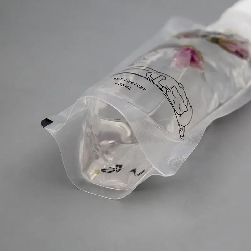 Vente en gros sac debout en plastique transparent jetable boisson jus/eau/liquide pochette à bec verseur