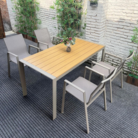 Chaise de jardin empilable en gros avec accoudoirs incurvés en aluminium, tissu textilène anti-UV et imperméable pour hôtels, villas et complexes hôteliers