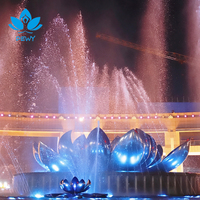 Fontaine combinée en acier inoxydable avec sculpture de lotus et jets LED RGB DMX512 pour projet de place publique emblématique