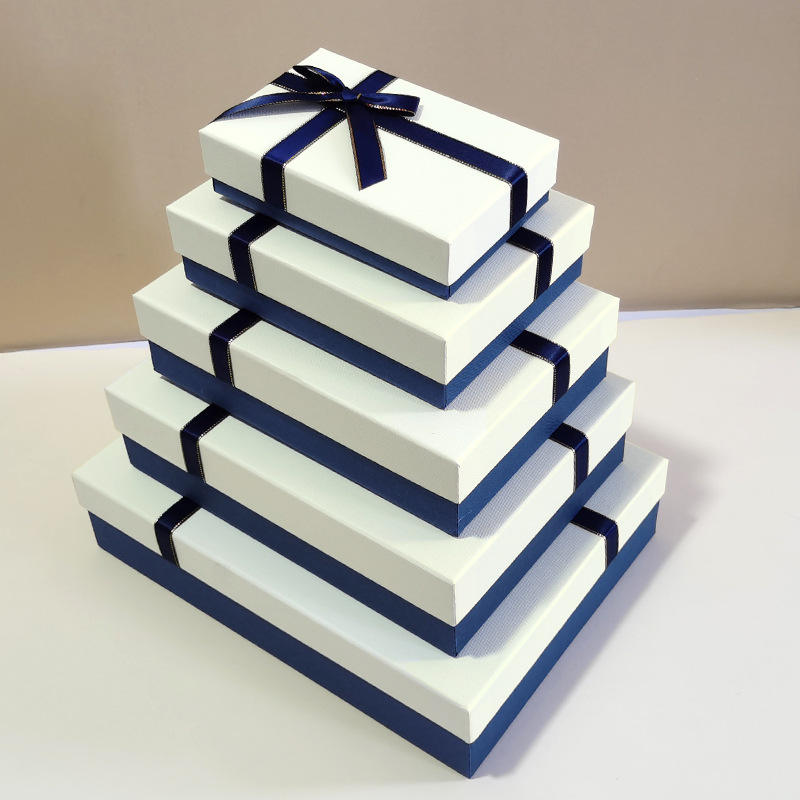 White box with blue ribbon