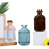 Vente en gros pot d'aromathérapie en rotin de luxe bouteille conteneur parfums liquides parfum de maison vide bâtonnets de roseau diffuseur bouteille en verre